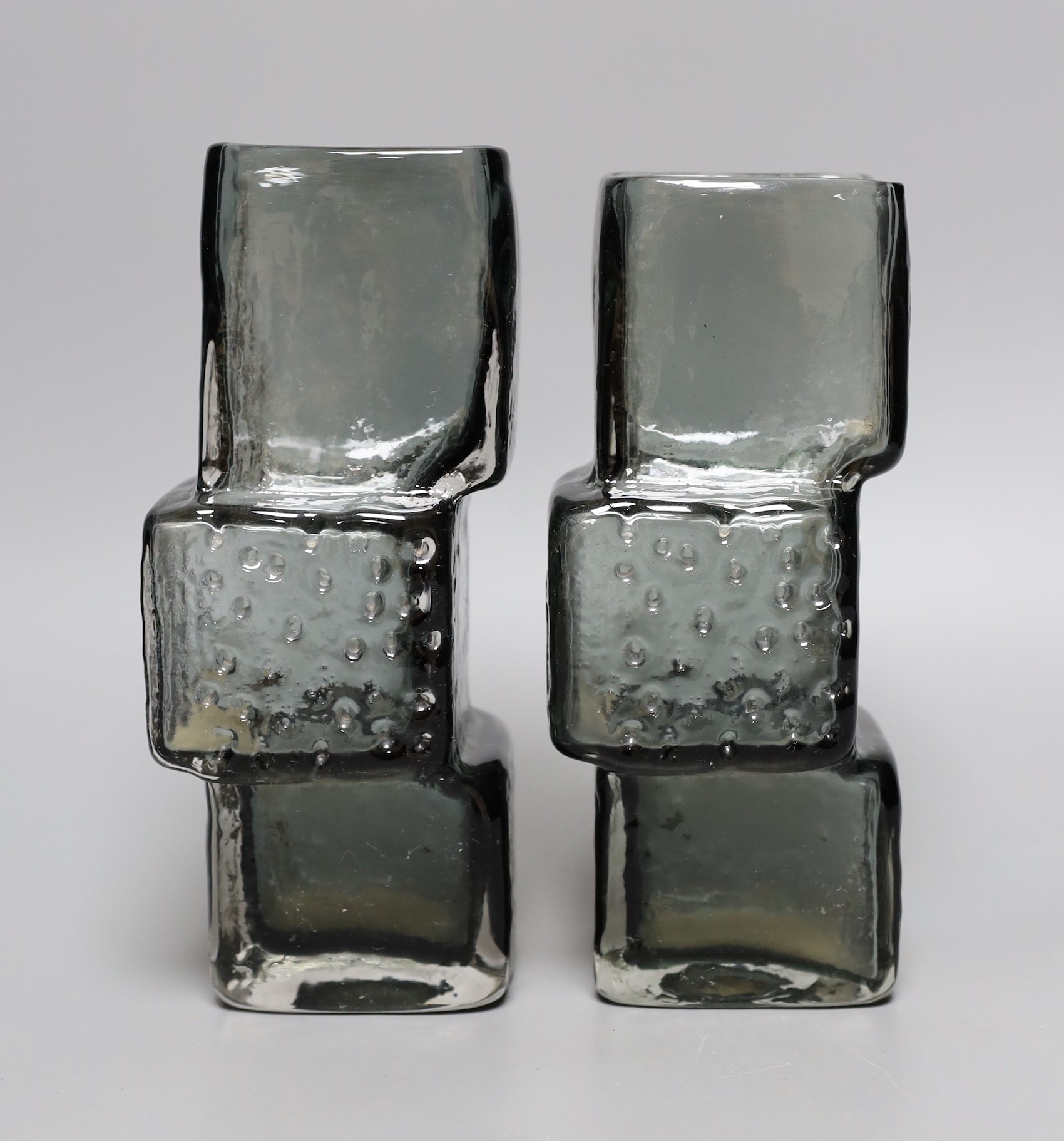 A pair of Whitefriars 'Drunken Bricklayer's' glass vases, designed by Geoffrey Baxter, pattern number 9673, smoked glass, 20cm tall